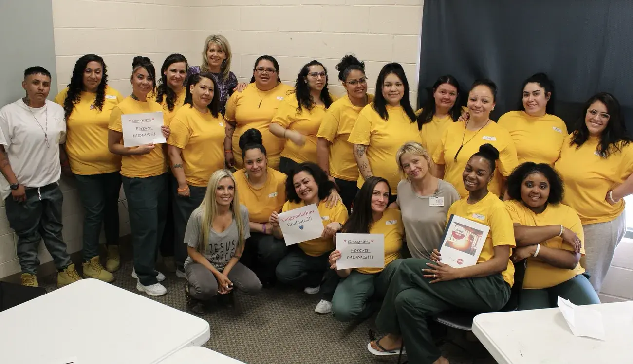 Forever Moms graduates celebrating together with their certificates